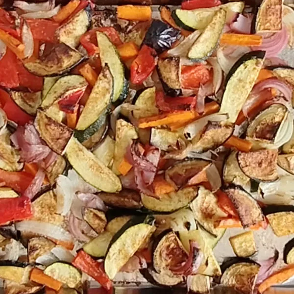 Roasted vegetables on a large metal tray.