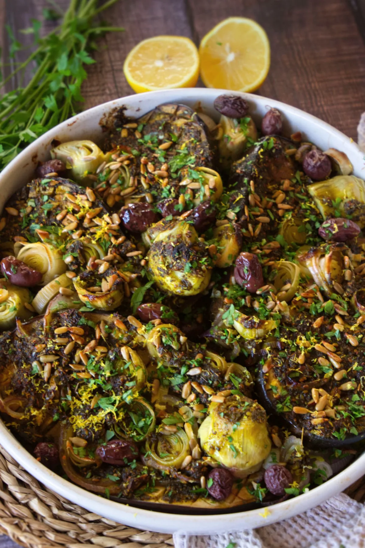 A large dish of Za'atar with roasted eggplant, leek, and artichoke hearts.