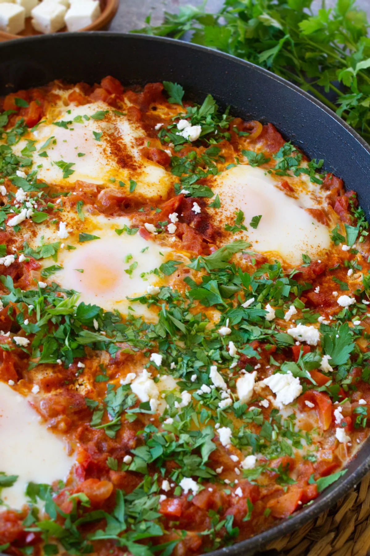 A large pan of Shakshuka with eggs poached on top. 