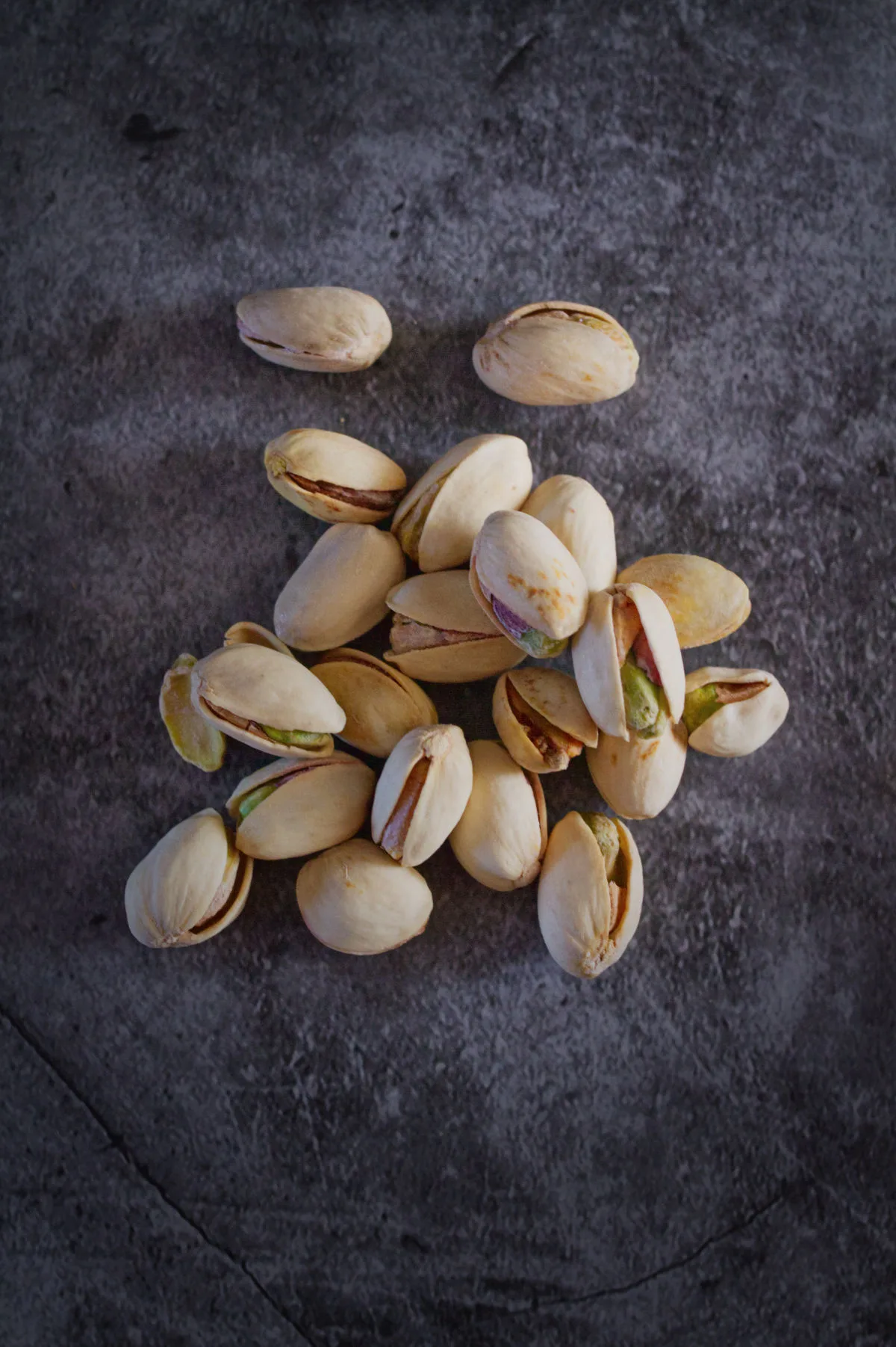 A small pile of pistachio nuts. 