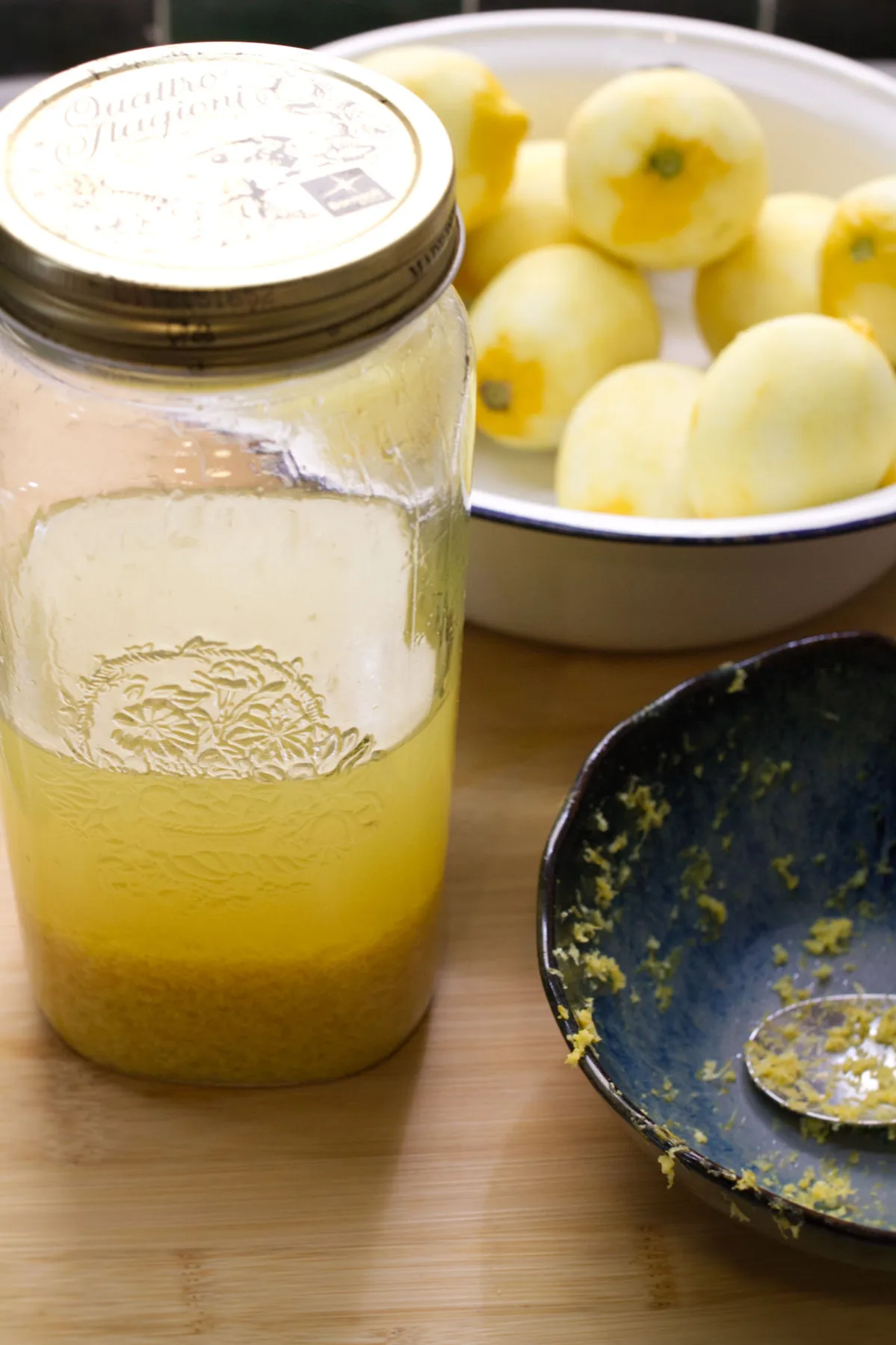 Zest from fresh lemons is added to a jar with Vodka.