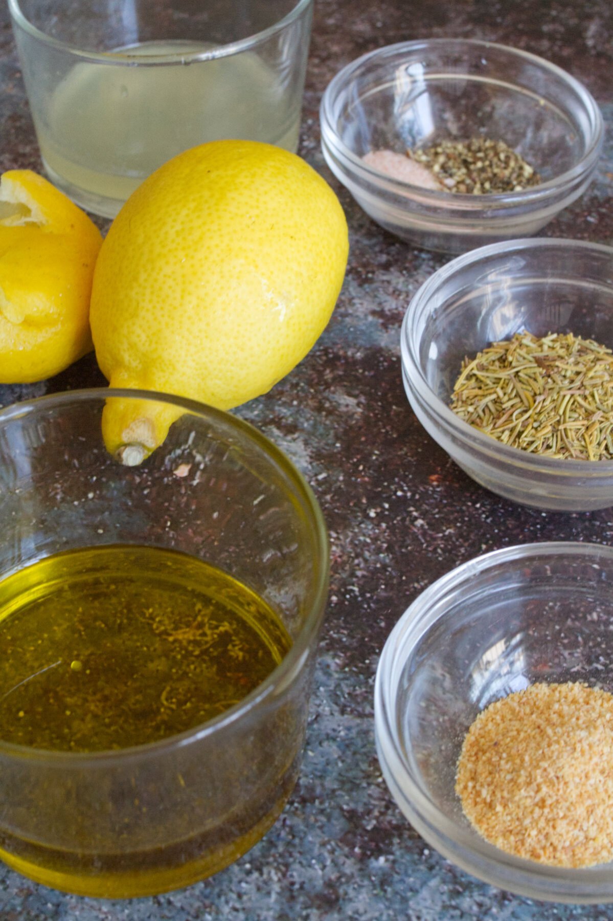 olive oil, lemons, rosemary, garlic, and seasoning.