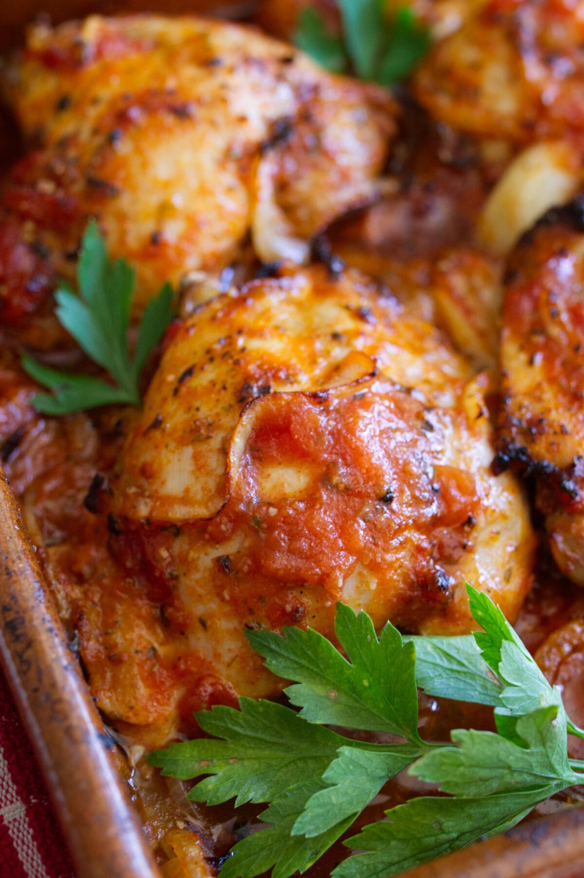 A large dish of Spanish-style chicken thighs