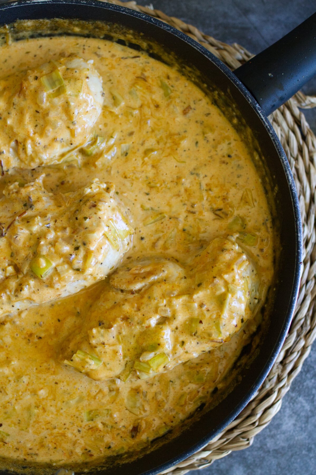 a pan of creamy garlic chicken with lots of sauce