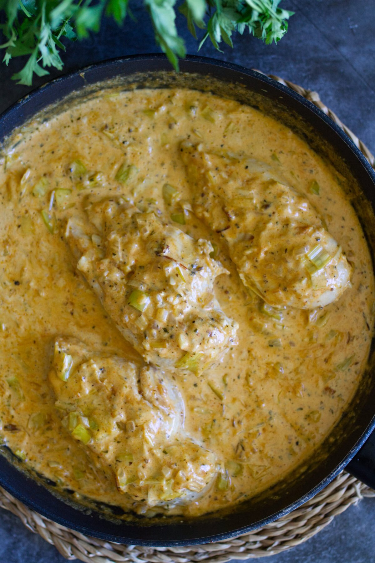 a pan of creamy garlic chicken with lots of sauce