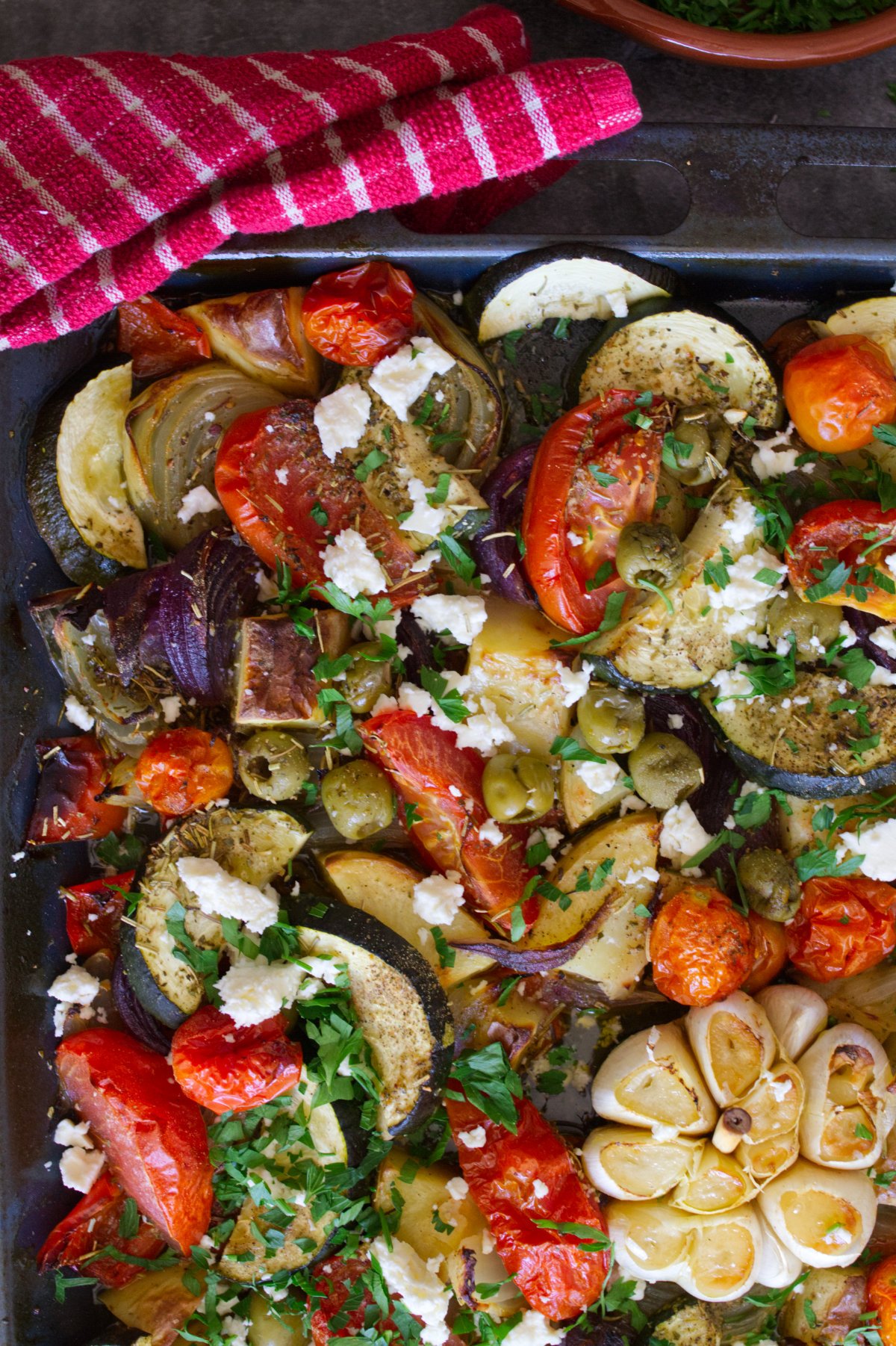 A sheet pan of roasted Mediterranean vegetables.