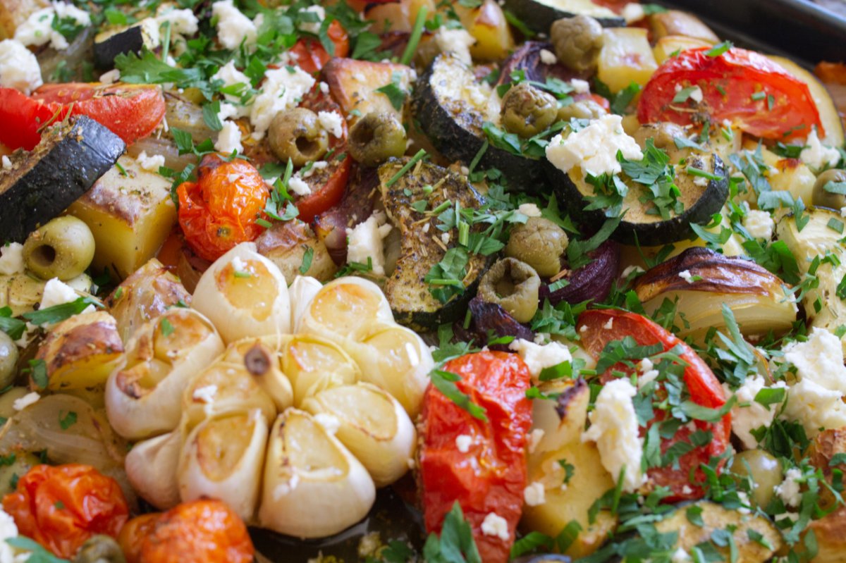 A sheet pan of roasted Mediterranean vegetables.