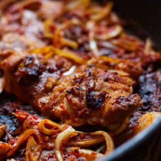 A large pan of harissa chicken