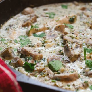 a large pan of creamy mushroom chicken