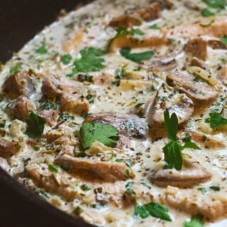 a large pan of creamy mushroom chicken