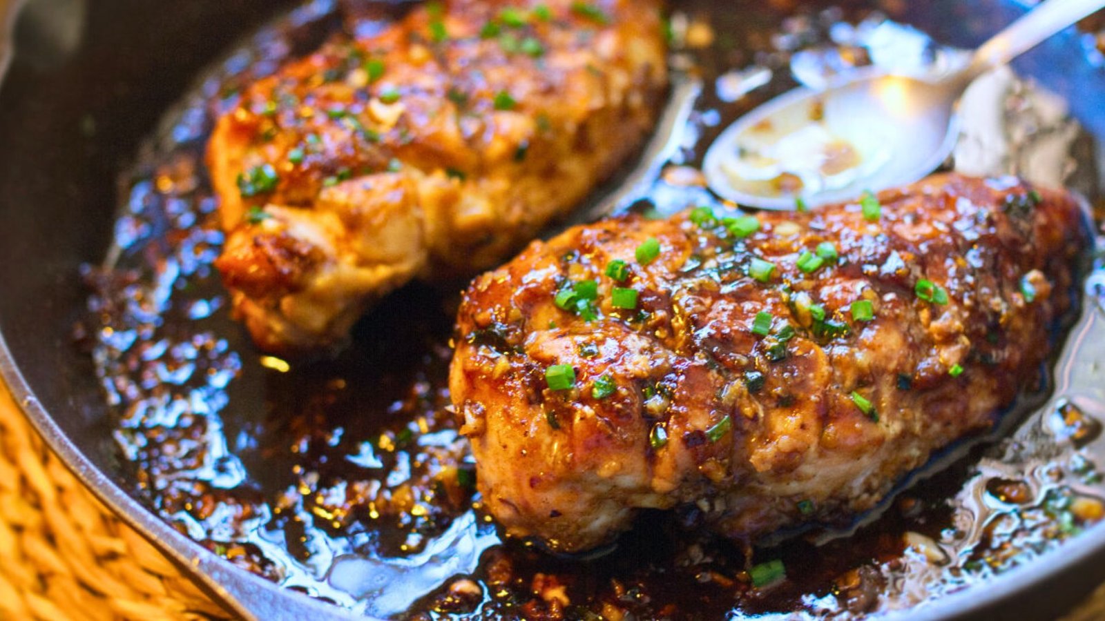 a pan of honey garlic butter chicken breasts