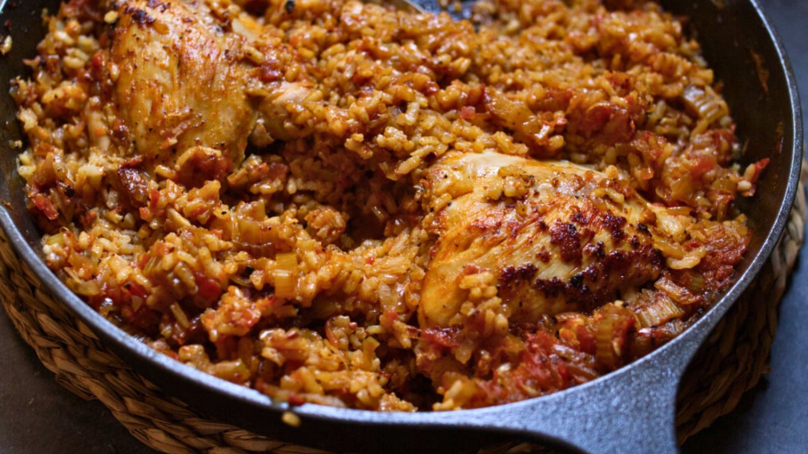 A large pan of Spanish-Style Chicken chorizo and rice