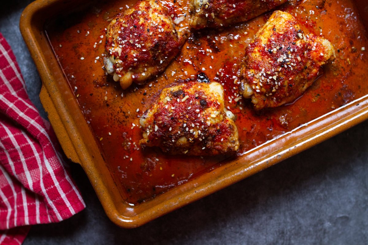 A pan of sweet and spicy harissa chicken thighs