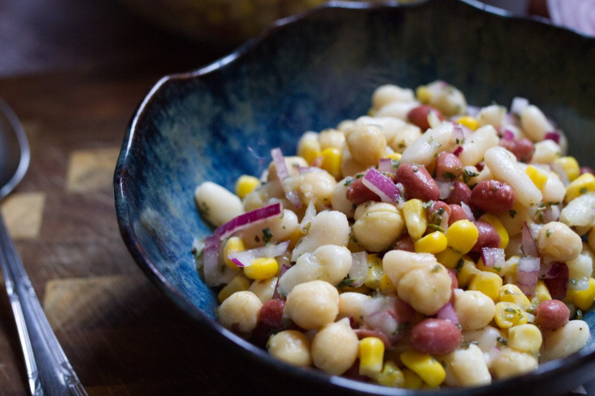Mediterranean-bean-salad-v2 - happymediterranean.com A small bowl of Mediterranean bean salad