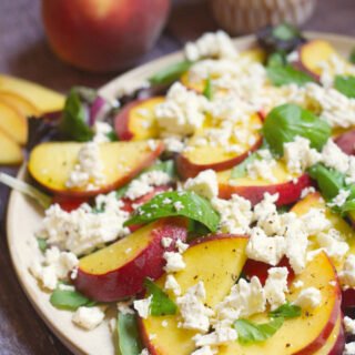 a platter of peach and feta salad