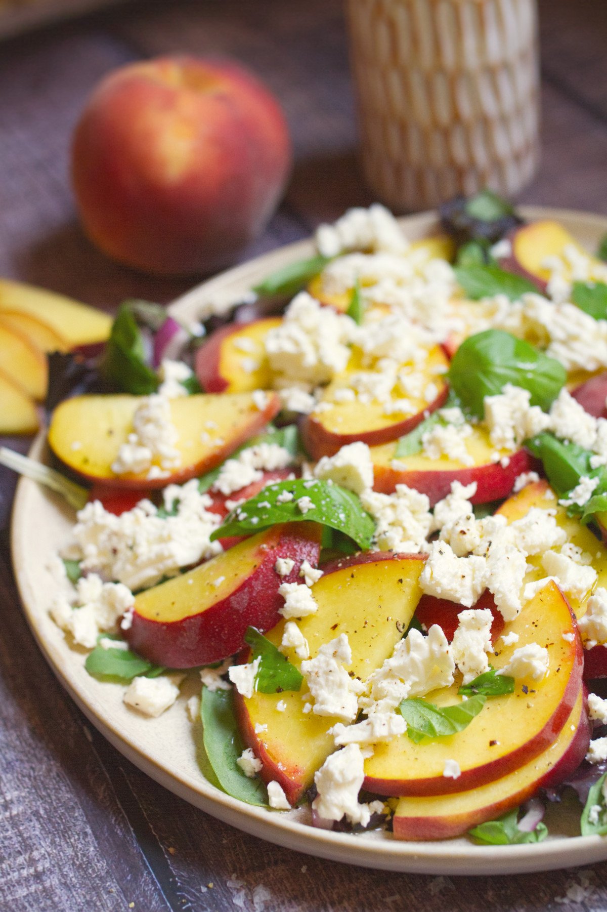 a platter of peach and feta salad