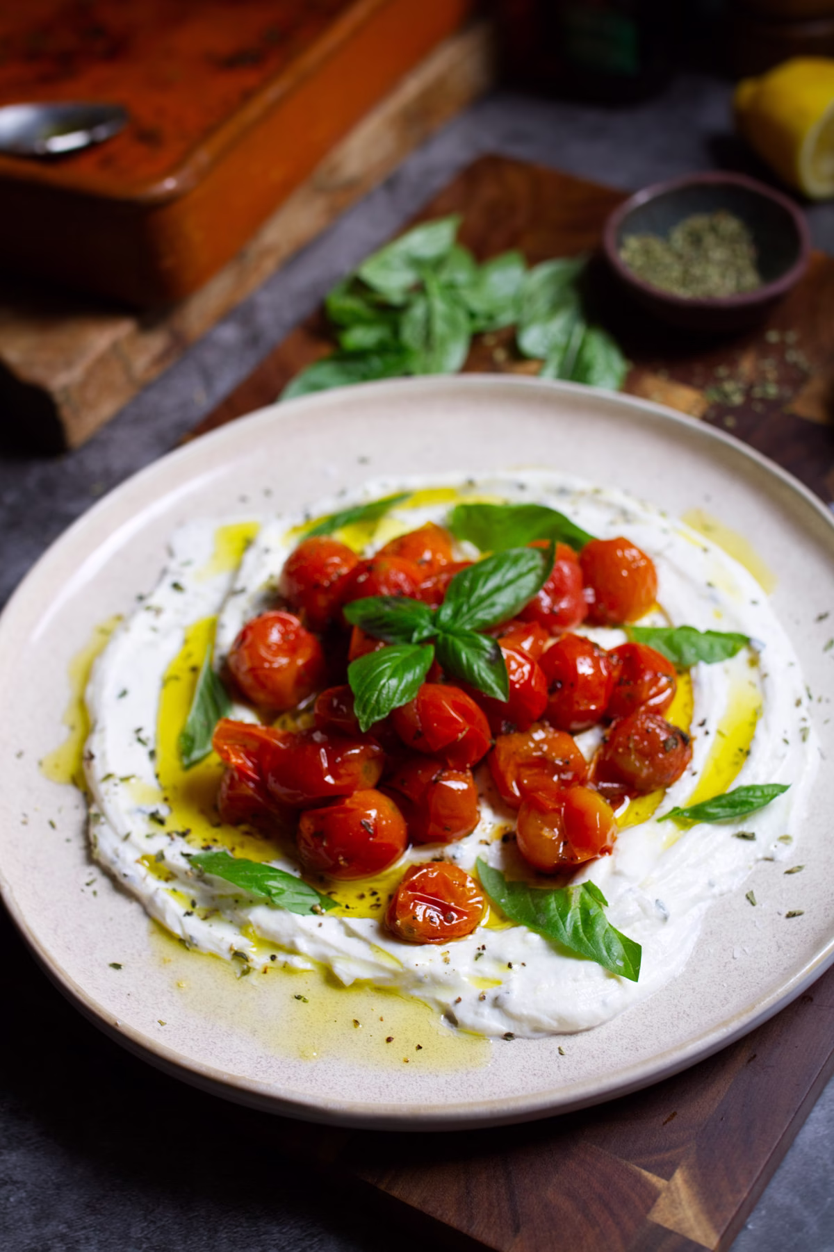 Creamy whipped ricotta appetizer with roasted cherry tomatoes