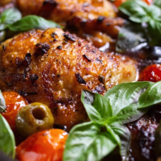 A pan of Mediterranean Chicken with Olives and Tomatoes