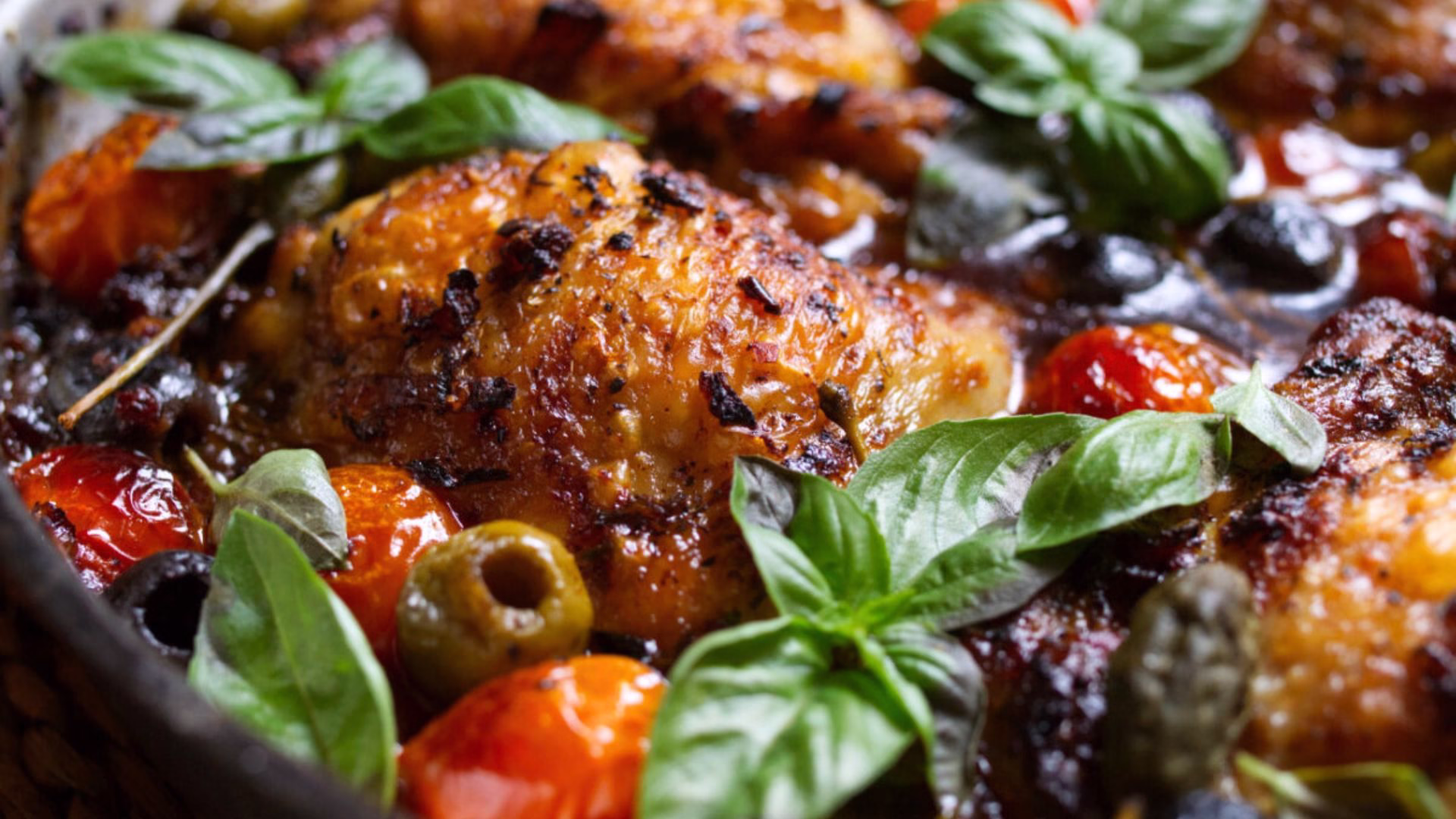 A pan of Mediterranean Chicken with Olives and Tomatoes