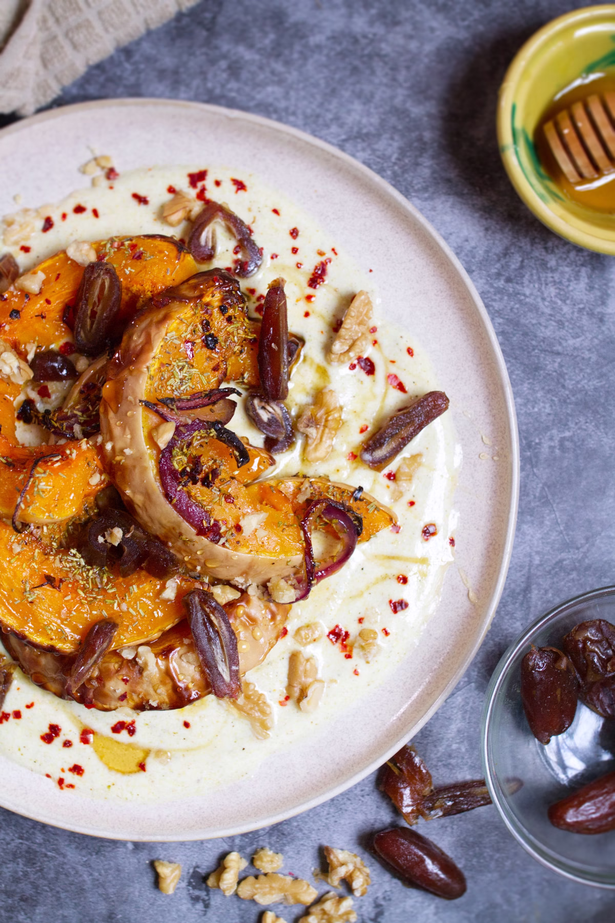 roasted butternut squash-v30 - happymediterranean.com A plate of roasted butternut squash with dates and walnuts