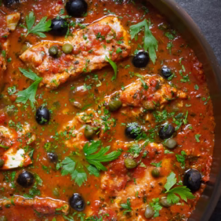 Fish Puttanesca-v15 - happymediterranean.com a large pan of Fish Puttanesca