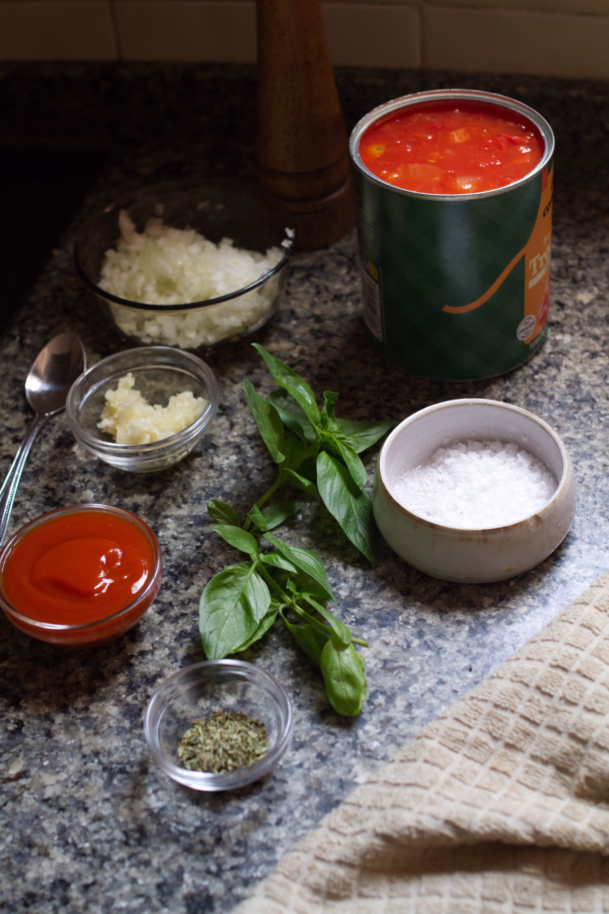 Napoli-sauce-ingredients - happymediterranean.com Ingredients used to make Napoli sauce sit on a kitchen counter