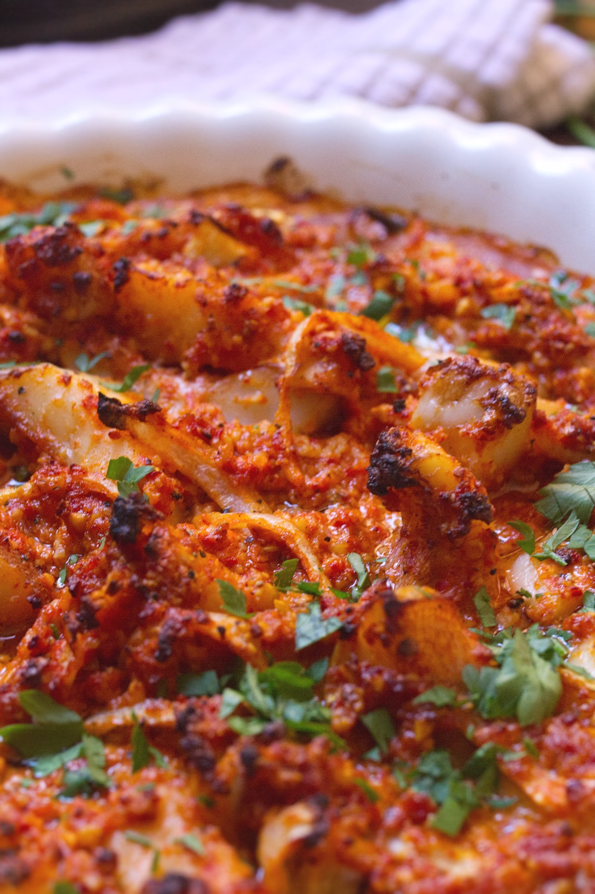 Some Mediterranean Fish in Romesco Sauce with a parsley garnish