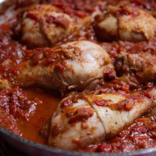 Pollo alla Cacciatora-v5 - happymediterranean.com A large pan of Pollo alla Cacciatora sits waiting to be served